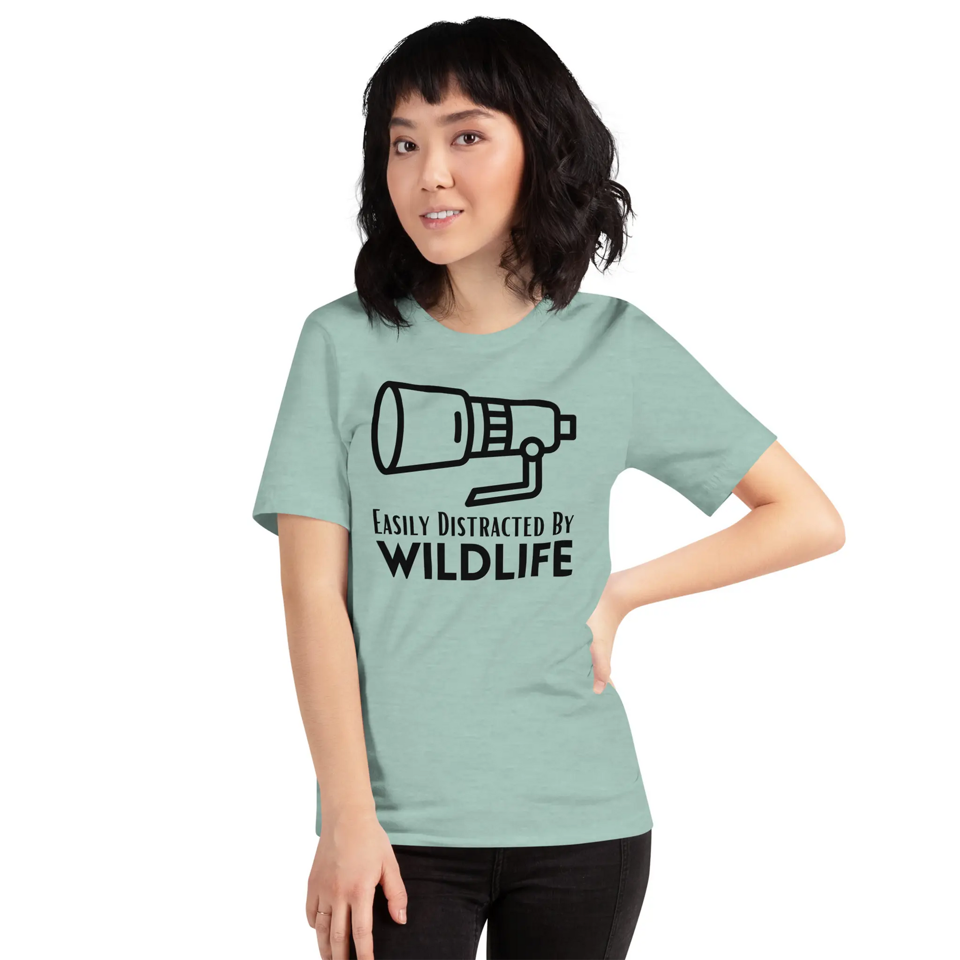 Woman wearing green wildlife photographer T-shirt.